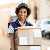 Female delivery person with boxes