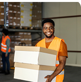 Warehouse worker holding boxes